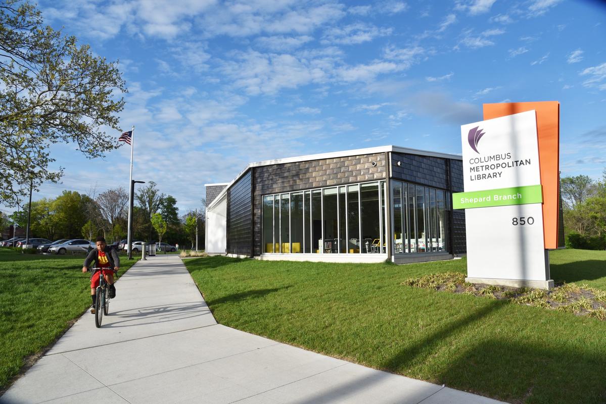 exterior view of Columbus Metro Library and lush green grass