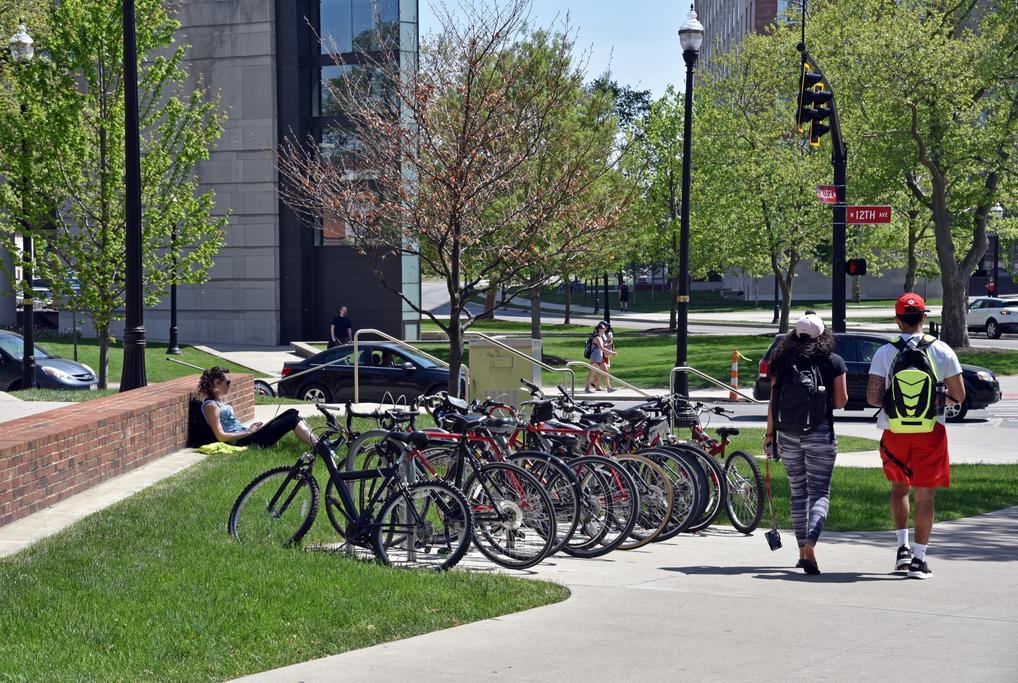 campus bike rack full of bikes
