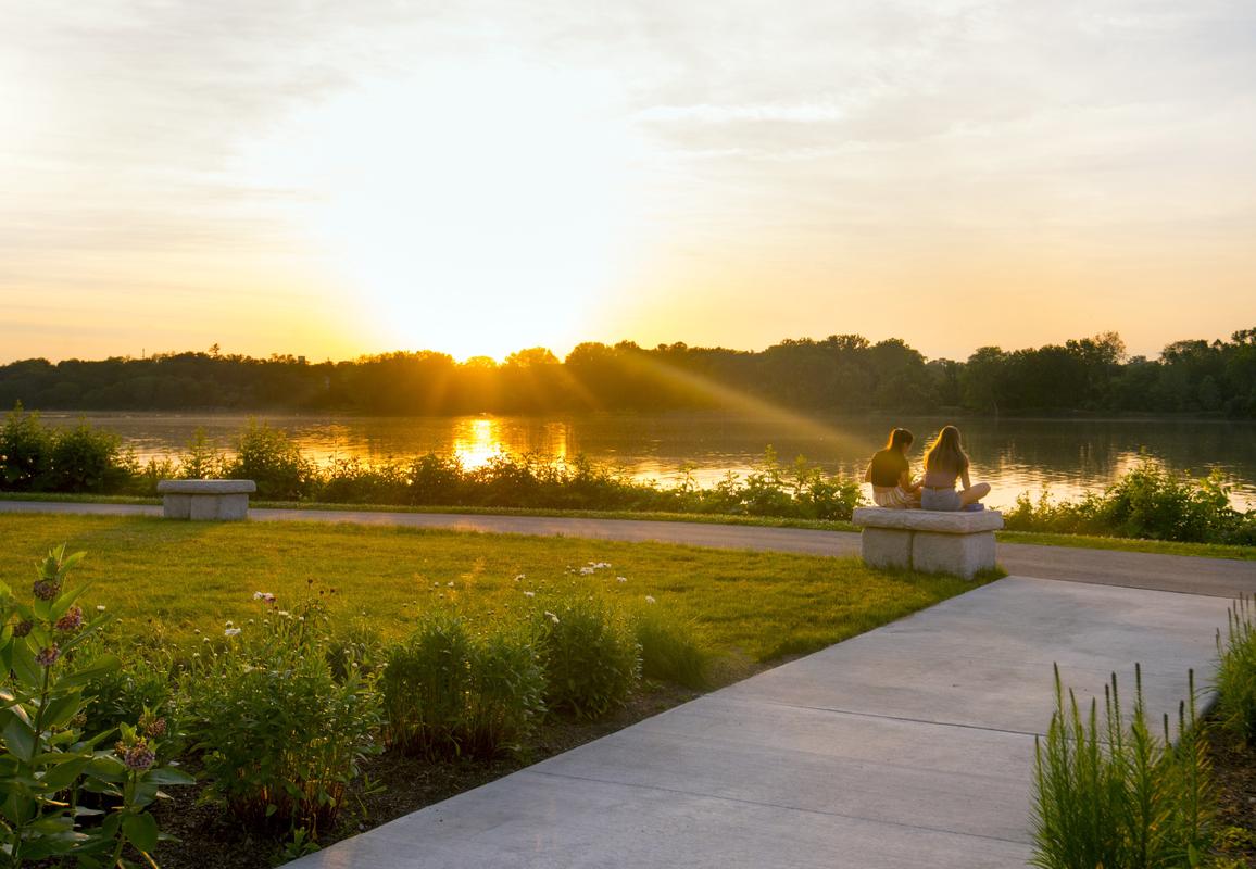 Friends watch the sunset over the river at Perrysburg Riverside Park.