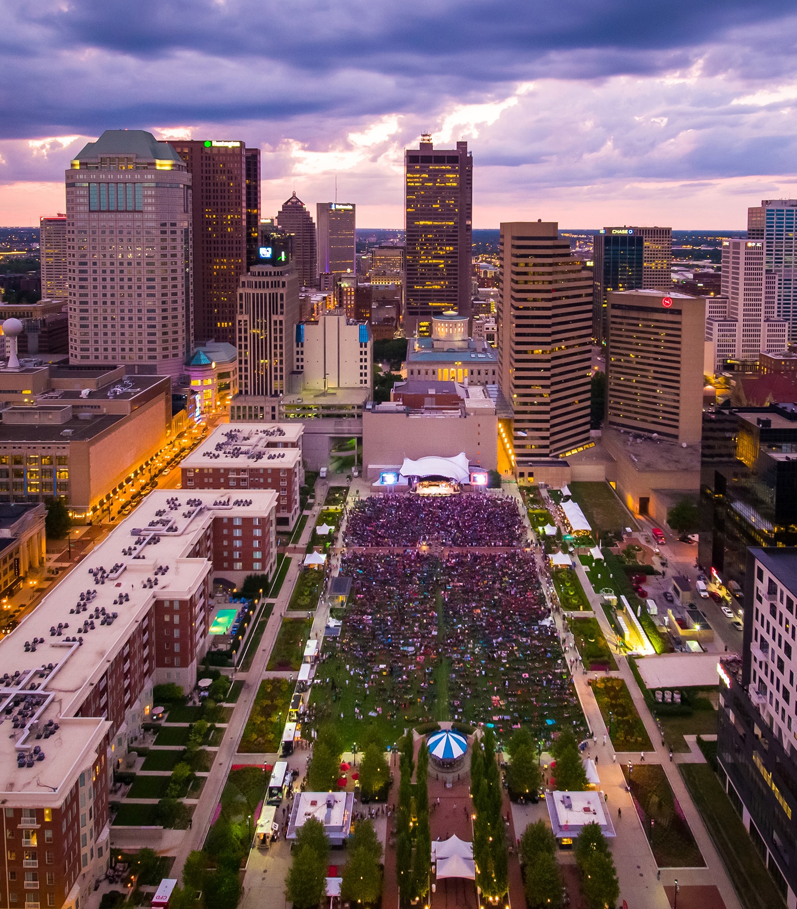 Nighttime view of crowd of people at Columbus Commons in Columbus, Ohio.